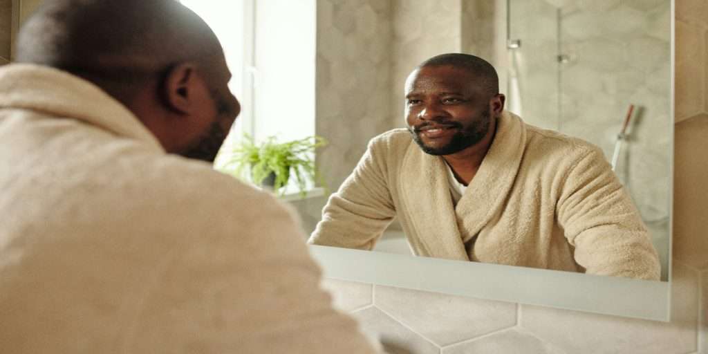 The Love Central - A mirror photo The Love Central - Animage of a man depicting self-love