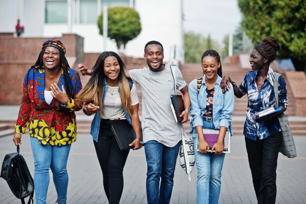 The Love Central - Group of five african college students spending time together on The impact of colonialism cannot be ignored