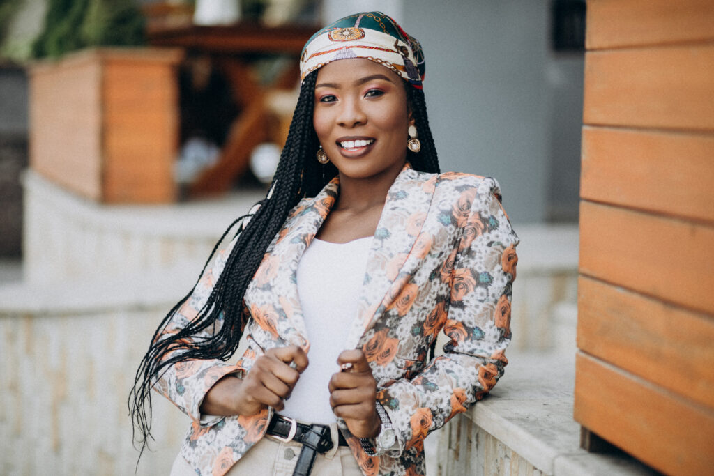 The Love Central - Stylish african american woman by the cafe African diaspora designers are trailblazers