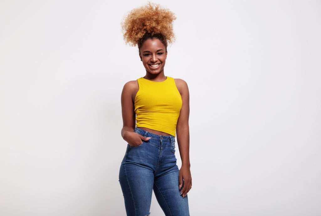 The Love Central - black woman with blonde hair wears a tail The Love Central -