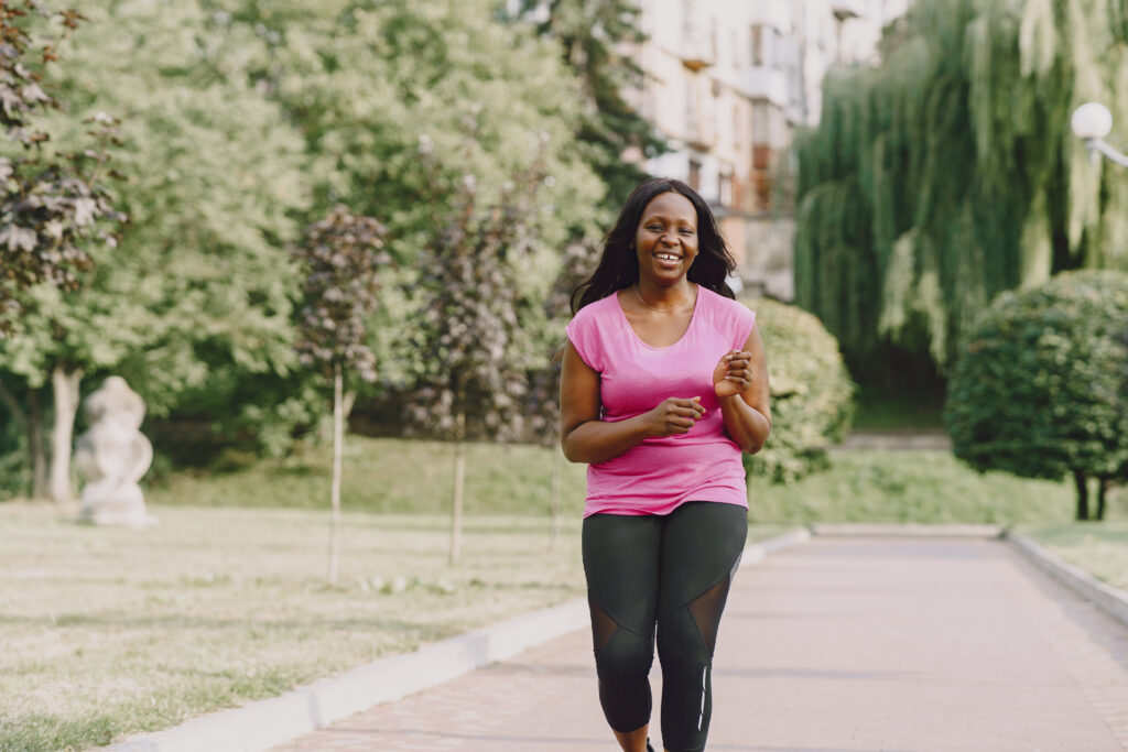 The Love Central - African american woman having workout in park in sportswear The Love Central -