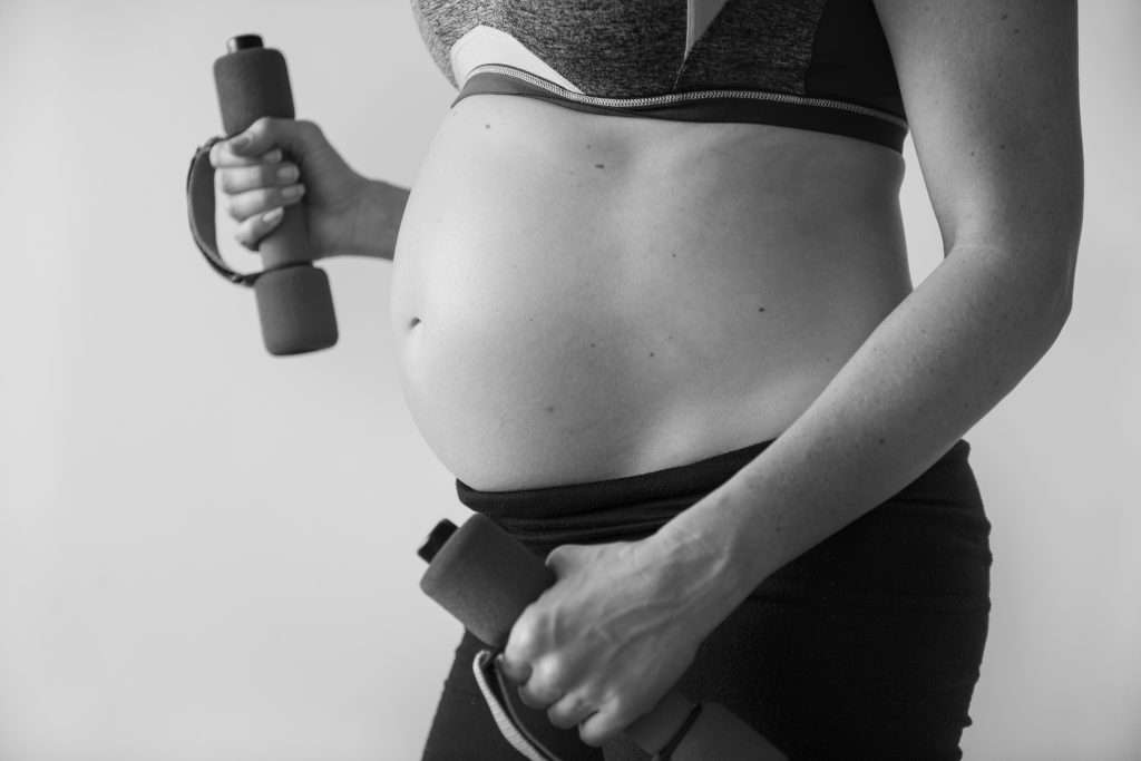 The Love Central - Pregnant woman doing light exercise The Love Central -