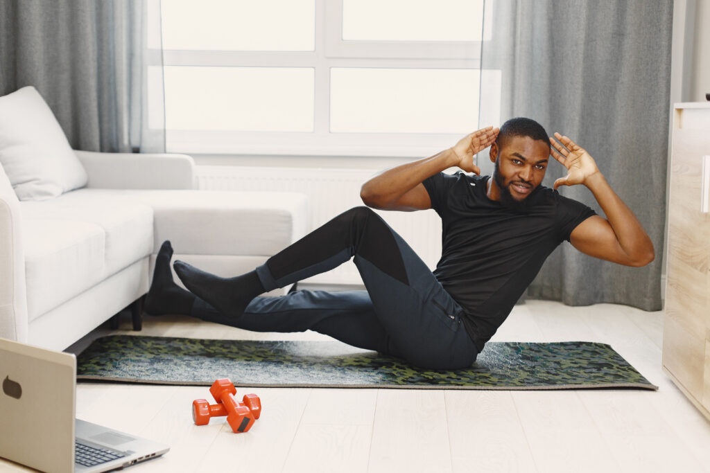 The Love Central - Handsome Afro American sportsman working out at home The Love Central -