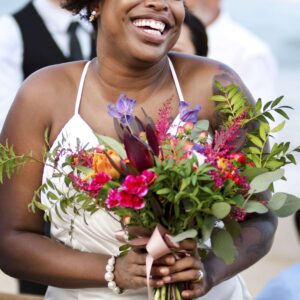 The Love Central - Happy bride and groom in a wedding ceremony at a tropical island The Love Central - The Pros and Cons of Having a Themed Wedding