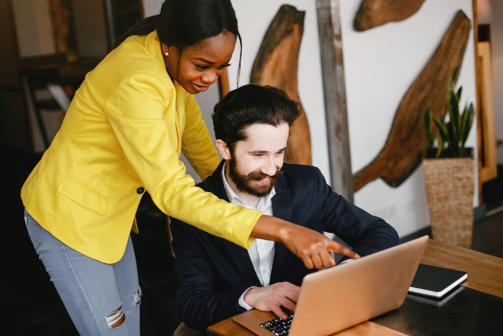 The Love Central - Stylish businessman working in a office with partner How to Create a Successful Side Hustle with Your Partner in 9 Easy Steps
