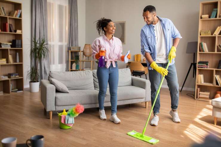 The Love Central - cheerful-black-spouses-cleaning-living-room-doing-housework-home_116547-28287 The Love Central -