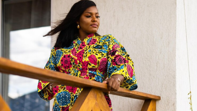 A beautiful Afruican lady dressed in Ankara