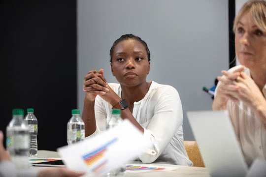 A beautiful black woman in a conference room