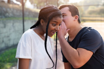 Couple whispering and gigling