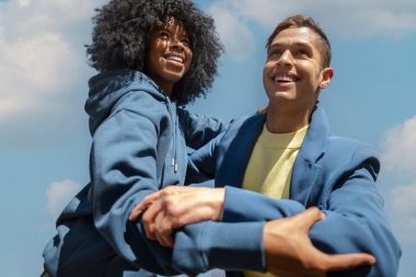 Couple playing and smiling.