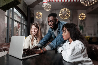Friends working on a laptop