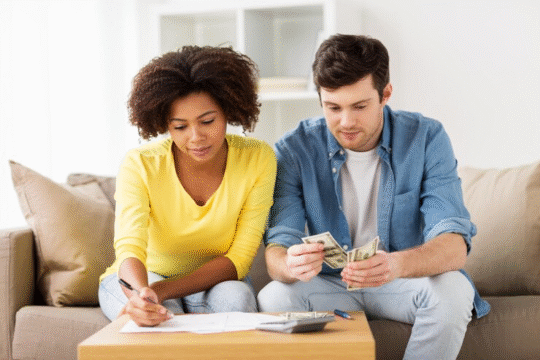 Couple calculating their expenses