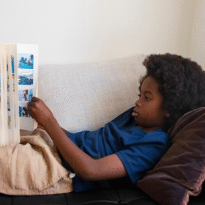 The Love Central - Unlocking Imagination: 10 Must-Read Children's Books to Spark a Lifetime of Wonder The Love Central - A child reading a story book.
