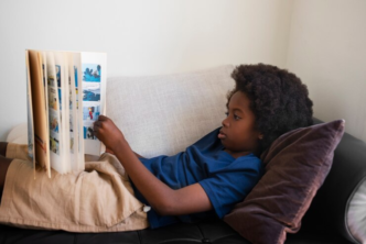 A child reading a story book.