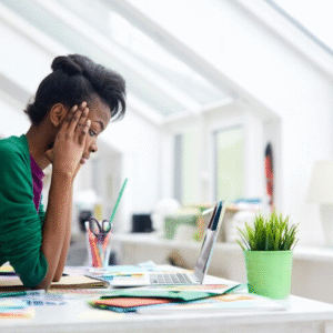 The Love Central - The Psychological Effects of Online Trolling on Africans Living Abroad The Love Central - A lady fully concentrating on her laptop device.
