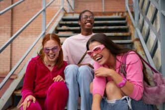Teenagers playing and laughing together.