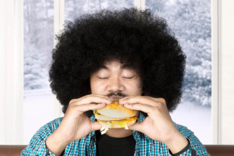 A guy eating burger