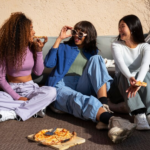 The Love Central - Female friends enjoying pizza.