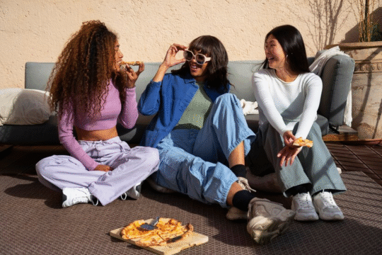 Female friends enjoying pizza.