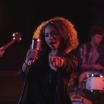 The Love Central - A singer perfoming on stage