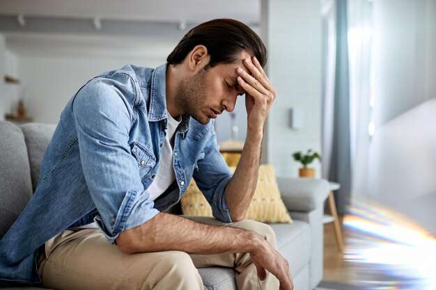 The Love Central - young-man-having-headache-holding-his-head-pain-home_637285-5905 The Love Central -