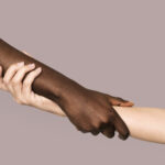 The Love Central - Diverse hands holding and supporting one another.