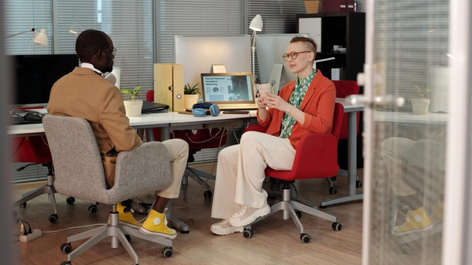 Colleagues chatting at the workplace.