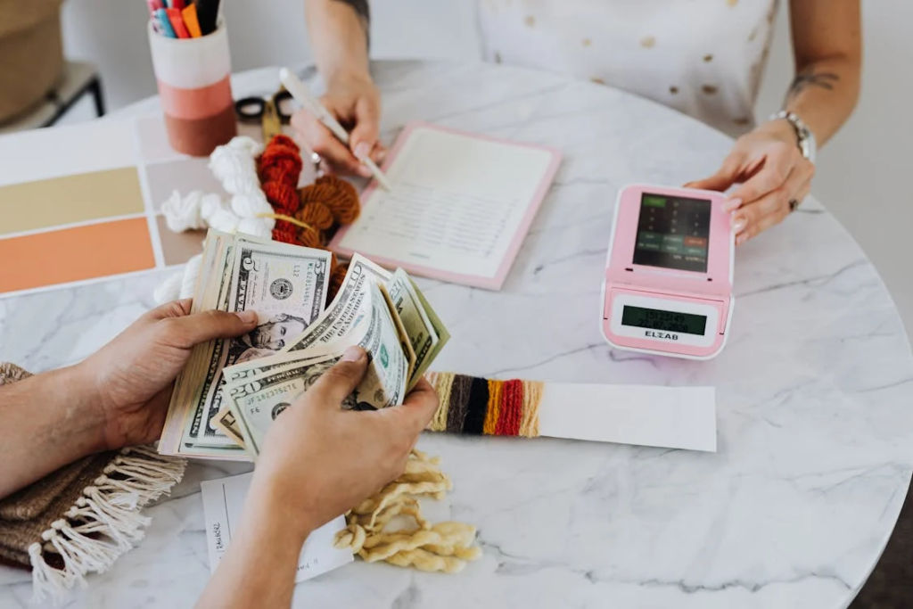 The Love Central - Salary Transparency: Should We Know What Everyone Makes? A worker receiving payment