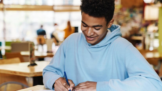 A student writing a note