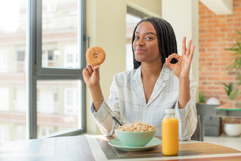 The Love Central - A lady with cereal breakfast on her table