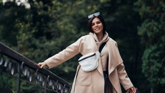 A lady dressed in a well-tailored trench coat
