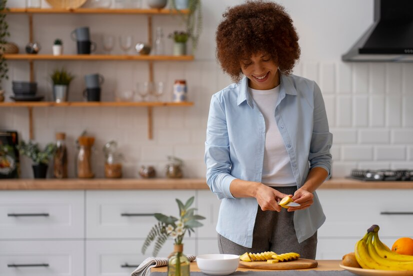 The Love Central - A lady slicing plantain
