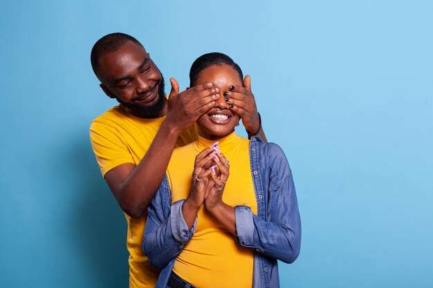 The Love Central - joyful-boyfriend-covering-eyes-girlfriend-prepare-surprise-doing-romantic-gesture-with-gift-positive-couple-showing-affection-being-love-lovers-playing-guess-who-game_482257-38336 The Love Central -