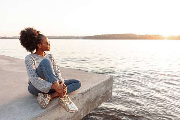 The Love Central - Breaking the Cycle of Self-Doubt: A Practical Guide to Self-Love The Love Central - A girl enjoying the calmness of the sea