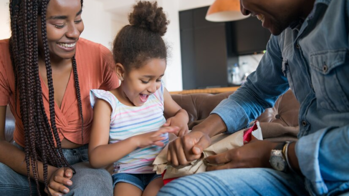 Daughter being gifted by parents