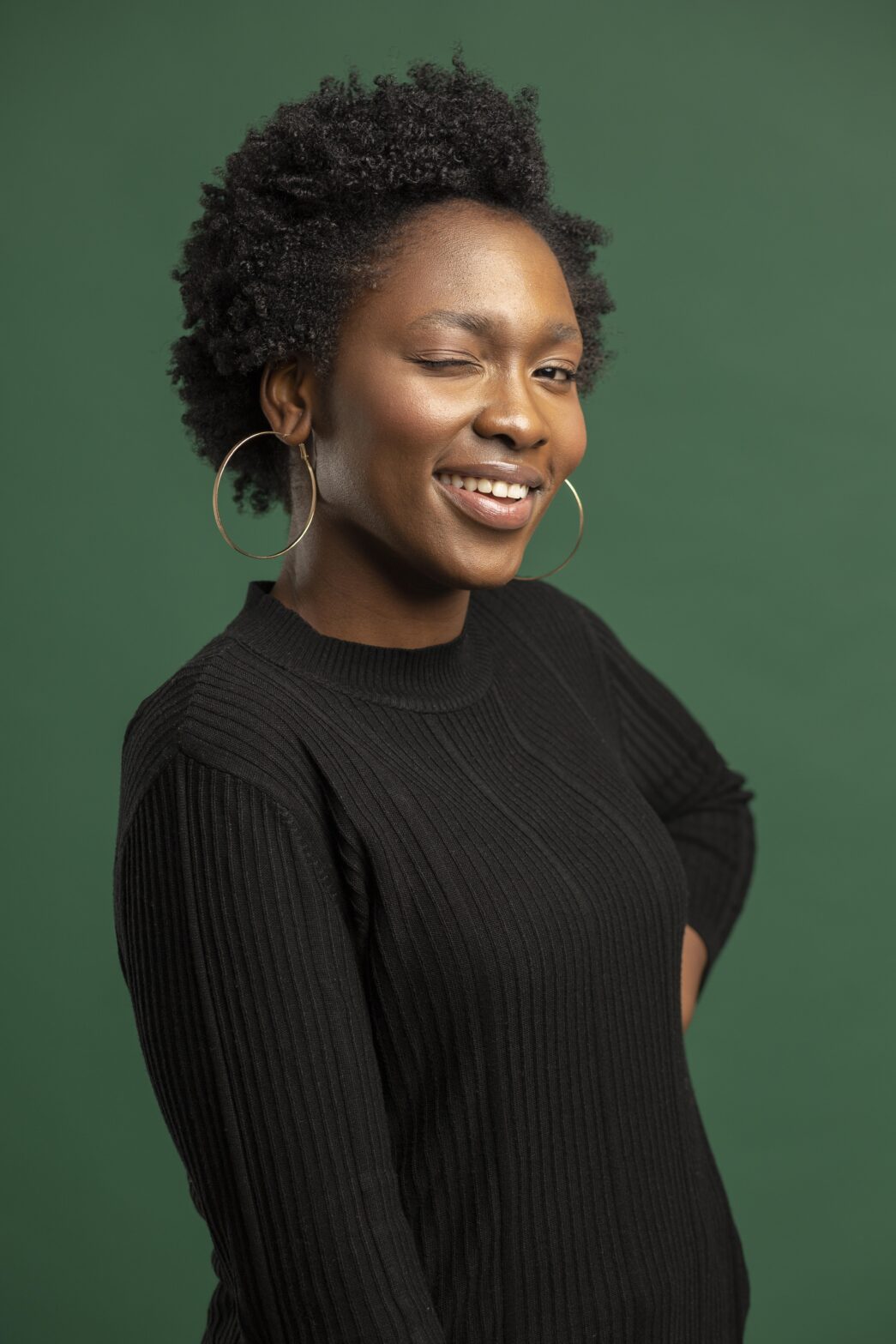 The Love Central - A afro lady with an eye wink