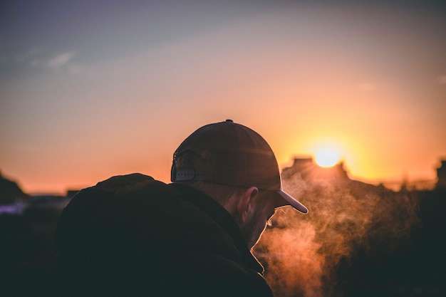 The Love Central - shallow-focused-shot-cap-wearing-man-s-back-sunset-golden-hour_181624-4687 The Love Central -