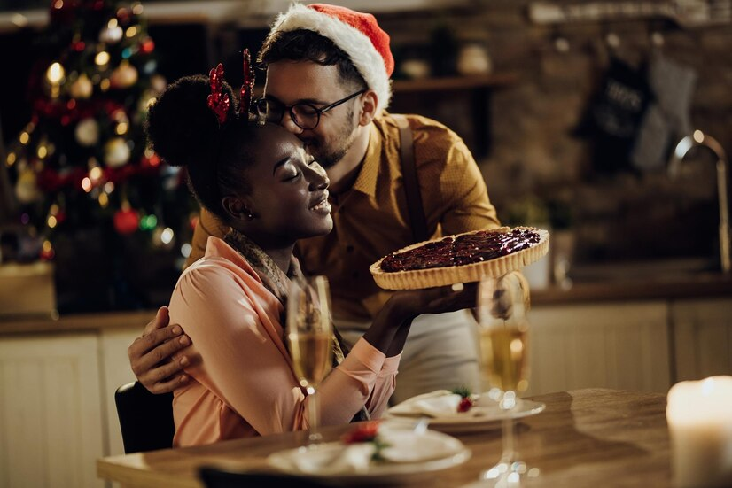The Love Central - 4 Christmas Romance Ideas to Spice Up Your Love The Love Central - Couple at a Christmas dinner at home