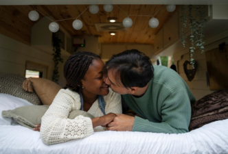 Couple kissing on the bed