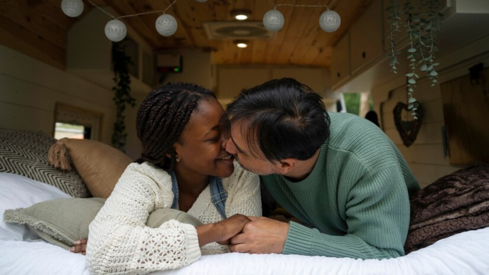 Couple kissing on the bed