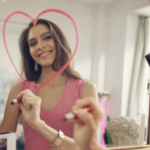 The Love Central - A lady drawing a heart on a mirroe