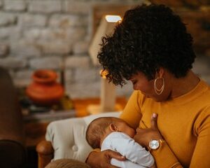 The Love Central - A black woman breastfeeding her baby